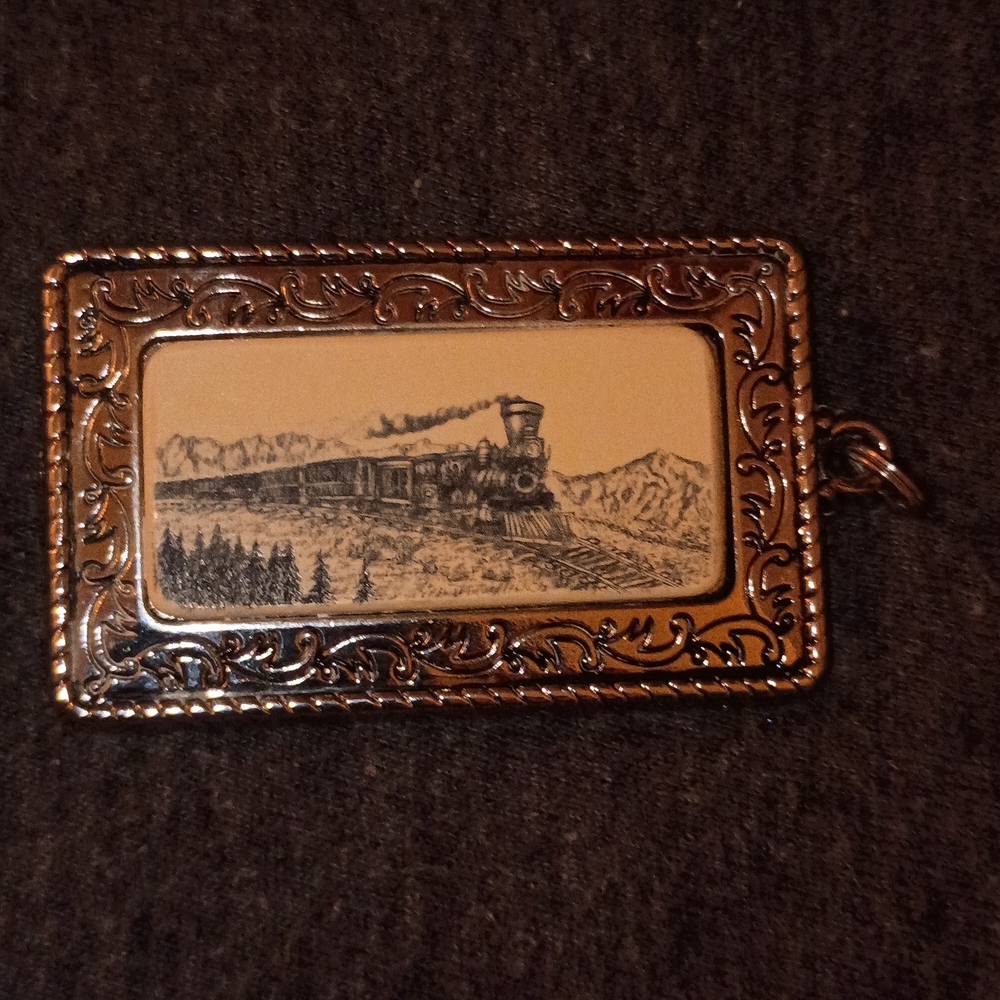 Vintage Train Pendant with Intricate Design